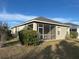 The backyard has a screened-in porch, and a large grass area at 5320 Aqua Breeze Dr, Bradenton, FL 34208