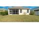 A well-kept backyard with a patio area, lush lawn, and privacy fence for outdoor enjoyment at 5320 Aqua Breeze Dr, Bradenton, FL 34208