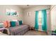 A calm bedroom features a plush daybed with vibrant cushions and natural light from the window at 5320 Aqua Breeze Dr, Bradenton, FL 34208