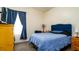 Cozy bedroom featuring blue accents, comfortable bedding, and natural light, creating a relaxing atmosphere at 5320 Aqua Breeze Dr, Bradenton, FL 34208