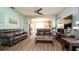 Spacious living room features modern ceiling fan and open layout to the kitchen at 5320 Aqua Breeze Dr, Bradenton, FL 34208