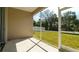 A screened patio area offers outdoor living with views of the lush green lawn and fencing at 5320 Aqua Breeze Dr, Bradenton, FL 34208