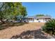 Expansive back yard featuring a well-maintained lawn and ample space for outdoor activities at 7710 Danube Dr # A, Hudson, FL 34667