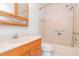 Bathroom featuring a wooden vanity with a sink and a shower and tub combo with beige tiling at 7710 Danube Dr # A, Hudson, FL 34667