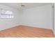 Spacious bedroom featuring a neutral decor, laminate wood flooring and a bright, airy atmosphere at 7710 Danube Dr # A, Hudson, FL 34667
