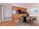 Bright dining area featuring a modern table set, stylish lighting, and access to the kitchen at 7710 Danube Dr # A, Hudson, FL 34667