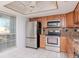 Modern kitchen featuring stainless steel appliances, sleek countertops, and ample cabinet space at 7710 Danube Dr # A, Hudson, FL 34667