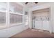 Laundry room with a white washer and dryer set and multiple windows for natural light at 7710 Danube Dr # A, Hudson, FL 34667