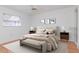 Bright and airy main bedroom featuring stylish furnishings, a ceiling fan, and a serene ambiance at 7710 Danube Dr # A, Hudson, FL 34667