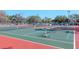 Well-maintained tennis courts with vibrant surfaces, providing ample space for recreational play at 7710 Danube Dr # A, Hudson, FL 34667