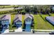 Picturesque aerial view of modern home with two-car garage, expansive lawns, and green landscaping at 9189 Royal River Cir, Parrish, FL 34219