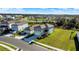 Beautiful aerial view of two-story home with attached garage and sprawling green lawn in suburban neighborhood at 9189 Royal River Cir, Parrish, FL 34219