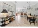 Inviting dining room with stylish light fixture and a decorative console table with a mirror at 2607 W Cleveland St # B, Tampa, FL 33609