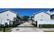 View of the community exterior featuring a gated entrance leading to well-maintained homes at 2607 W Cleveland St # B, Tampa, FL 33609