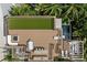 Aerial view of roof top deck with a pool, outdoor kitchen, lounging and dining areas at 415 N Bay Blvd, Anna Maria, FL 34216