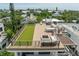 Aerial view of a rooftop featuring a kitchen, dining area, seating, and bocce ball court at 415 N Bay Blvd, Anna Maria, FL 34216