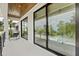 Enjoy outdoor relaxation on this balcony featuring sliding glass doors and stunning views at 415 N Bay Blvd, Anna Maria, FL 34216