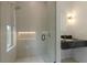 Modern bathroom with glass enclosed shower and floating vanity at 415 N Bay Blvd, Anna Maria, FL 34216
