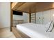 Bright bedroom with built in storage, modern fixtures and flat screen television at 415 N Bay Blvd, Anna Maria, FL 34216