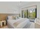 Cozy bedroom showcasing a light gray headboard with large windows for scenic views at 415 N Bay Blvd, Anna Maria, FL 34216