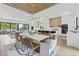 Open layout combining the living, dining, and kitchen areas, with an abundance of natural light and modern finishes at 415 N Bay Blvd, Anna Maria, FL 34216
