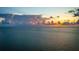 Stunning aerial view of the ocean at sunset with colorful sky and calm water at 415 N Bay Blvd, Anna Maria, FL 34216