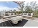 Spacious outdoor patio featuring dual couches and serene neighborhood views at 415 N Bay Blvd, Anna Maria, FL 34216
