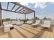 Entertaining roof deck featuring ample seating, lounge chairs, and neighborhood views at 415 N Bay Blvd, Anna Maria, FL 34216