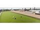 Relaxing rooftop with a fire pit, bocce ball court, and comfortable seating, perfect for outdoor activities at 415 N Bay Blvd, Anna Maria, FL 34216