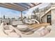 Relaxing rooftop deck featuring plush outdoor seating, stylish decor, and an inviting pergola at 415 N Bay Blvd, Anna Maria, FL 34216