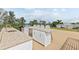 Outdoor rooftop kitchen with an island, sink, mini-fridge, and seating for cooking and entertaining at 415 N Bay Blvd, Anna Maria, FL 34216