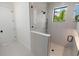 Sleek shower enclosure with glass door and modern fixtures, enhanced by natural light at 415 N Bay Blvd, Anna Maria, FL 34216