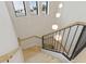 Bright staircase with modern railings and stylish pendant lights at 415 N Bay Blvd, Anna Maria, FL 34216