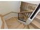 Modern staircase with wooden steps, sleek railings, and a light, airy design at 415 N Bay Blvd, Anna Maria, FL 34216