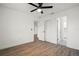Large bedroom includes ceiling fan, wood floors, closet space, and neutral paint at 4107 Mulgrave Ave, North Port, FL 34287