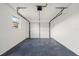 Clean, empty garage with painted floor and walls, a garage door, and a window for natural light at 4107 Mulgrave Ave, North Port, FL 34287