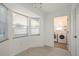 Bright breakfast nook and laundry room featuring multiple windows, tile flooring, and lots of light at 4107 Mulgrave Ave, North Port, FL 34287