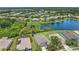 Beautiful aerial view of a suburban community featuring a lake and well-maintained landscaping at 11530 57Th Street E Cir, Parrish, FL 34219