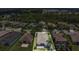 Aerial view of a home in a neighborhood with surrounding houses and lush greenery at 11530 57Th Street E Cir, Parrish, FL 34219