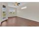 Spacious bedroom featuring hardwood flooring, ceiling fan, and natural light at 11530 57Th Street E Cir, Parrish, FL 34219