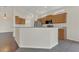 Kitchen with granite breakfast bar, stainless steel refrigerator and modern appliances at 11530 57Th Street E Cir, Parrish, FL 34219
