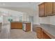 Kitchen featuring granite countertops, stainless steel dishwasher, and light wood cabinetry at 11530 57Th Street E Cir, Parrish, FL 34219