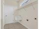 Functional laundry room with sink, door, and shelving for storage at 11530 57Th Street E Cir, Parrish, FL 34219
