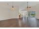 Spacious living room with hardwood floors and abundant natural light from sliding glass doors at 11530 57Th Street E Cir, Parrish, FL 34219