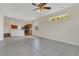 Spacious living room featuring tile floors, kitchen view, and natural light at 11530 57Th Street E Cir, Parrish, FL 34219