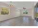 Inviting living room with tile floors and multiple windows for natural light at 11530 57Th Street E Cir, Parrish, FL 34219