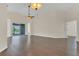 Bright living area with hardwood floors and sliding glass doors opening to the lanai at 11530 57Th Street E Cir, Parrish, FL 34219