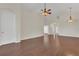 Open living room featuring hardwood floors, ceiling fan, and natural light at 11530 57Th Street E Cir, Parrish, FL 34219