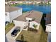Aerial view of home featuring a large lake view and car parked in the driveway at 345 Mangrove Manor Dr, Apollo Beach, FL 33572