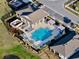 Aerial view showcasing the community pool, grilling area, and surrounding landscaping with ample seating at 345 Mangrove Manor Dr, Apollo Beach, FL 33572